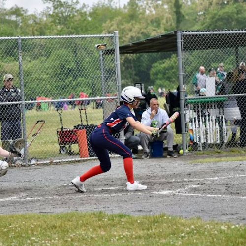 softball player bunting at a game